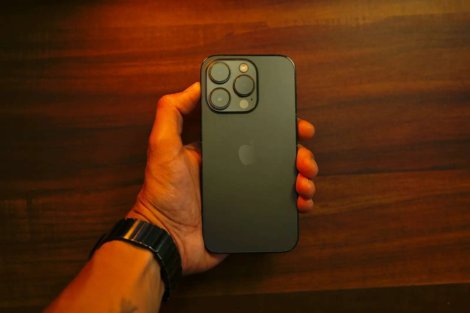 A hand holding an iPhone